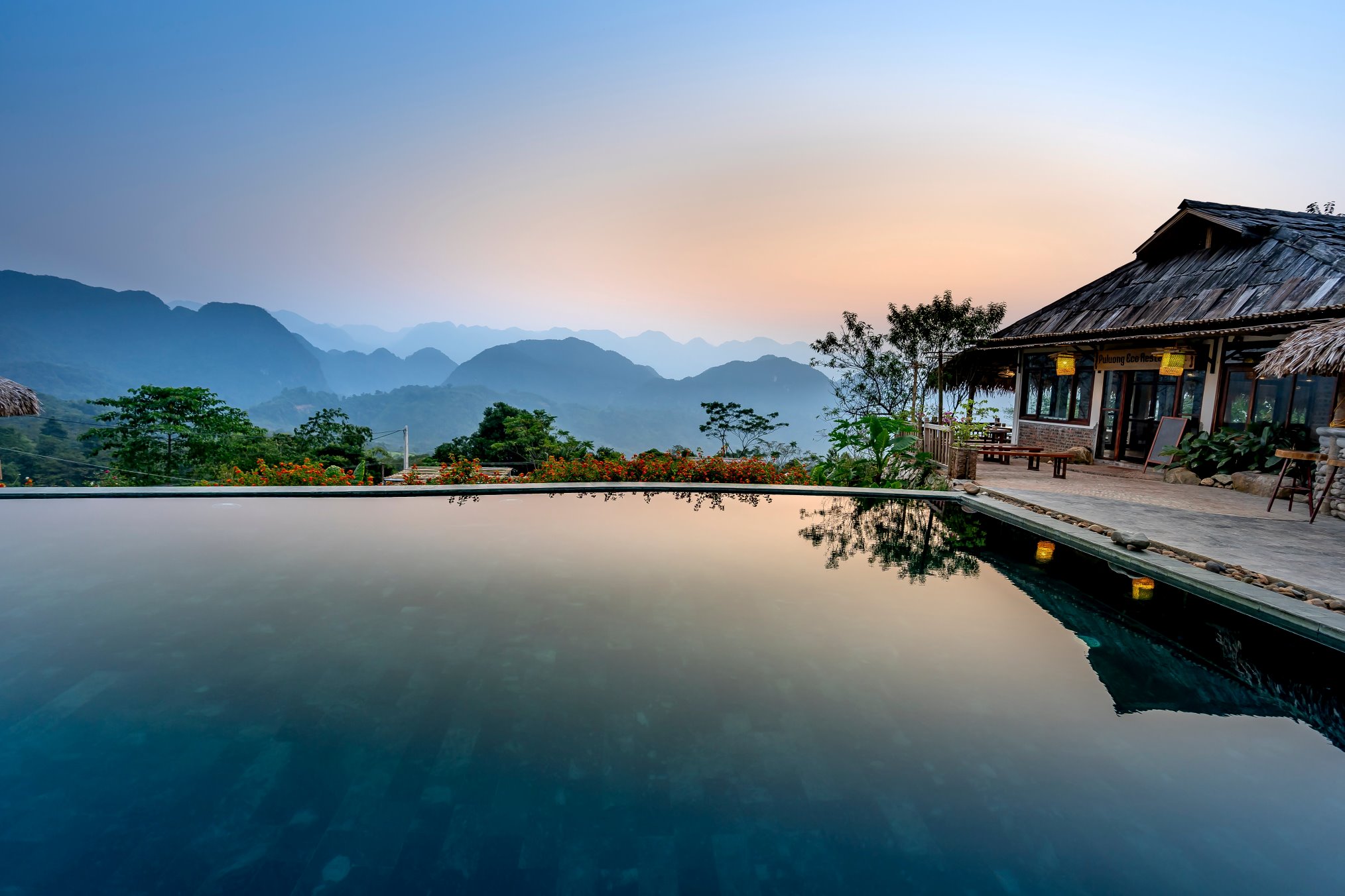 A Short-Term Rental House With a Pool Providing a Mesmerizing Guest Experience Overlooking the Mountains at Dusk