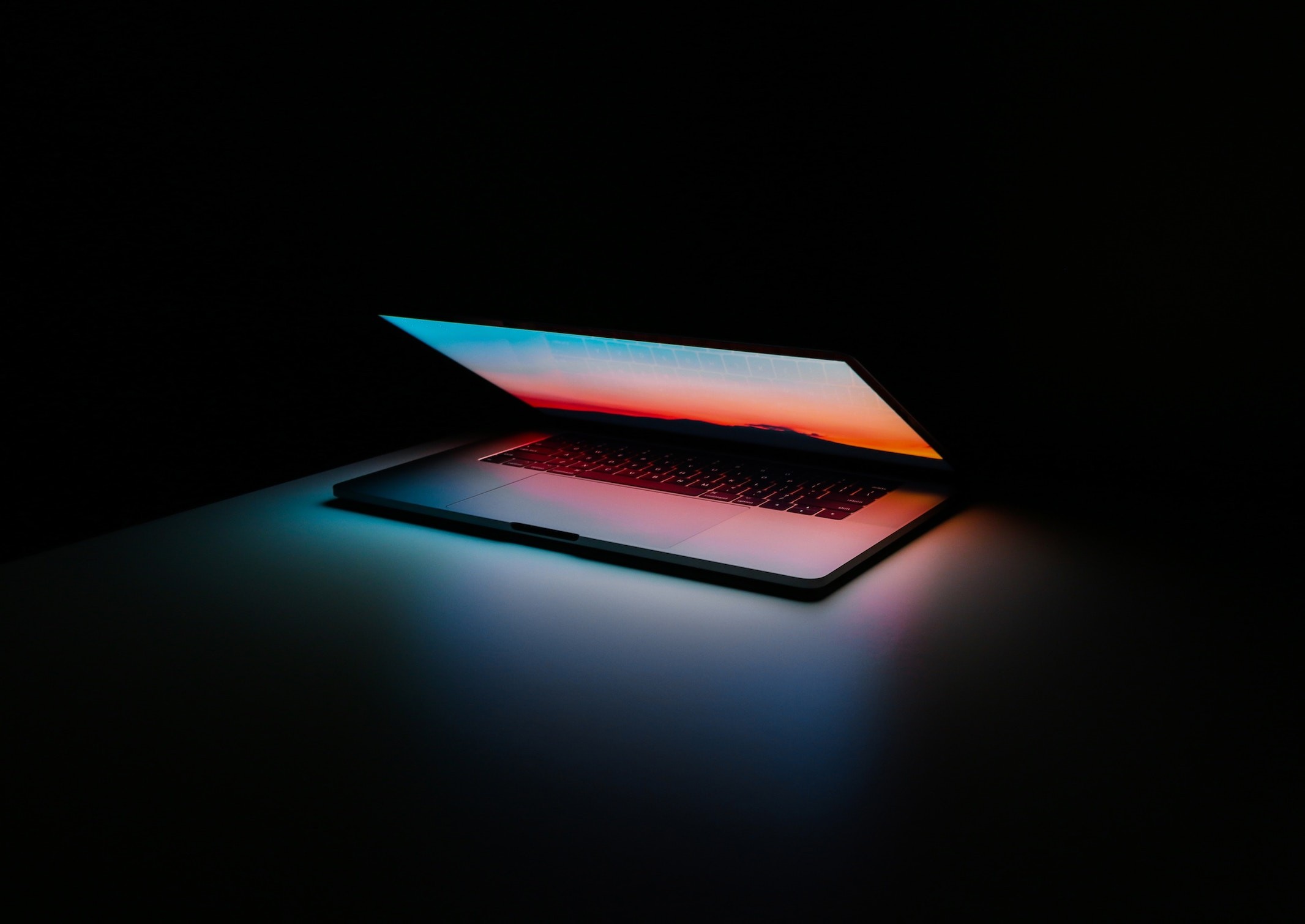 An open laptop in the dark