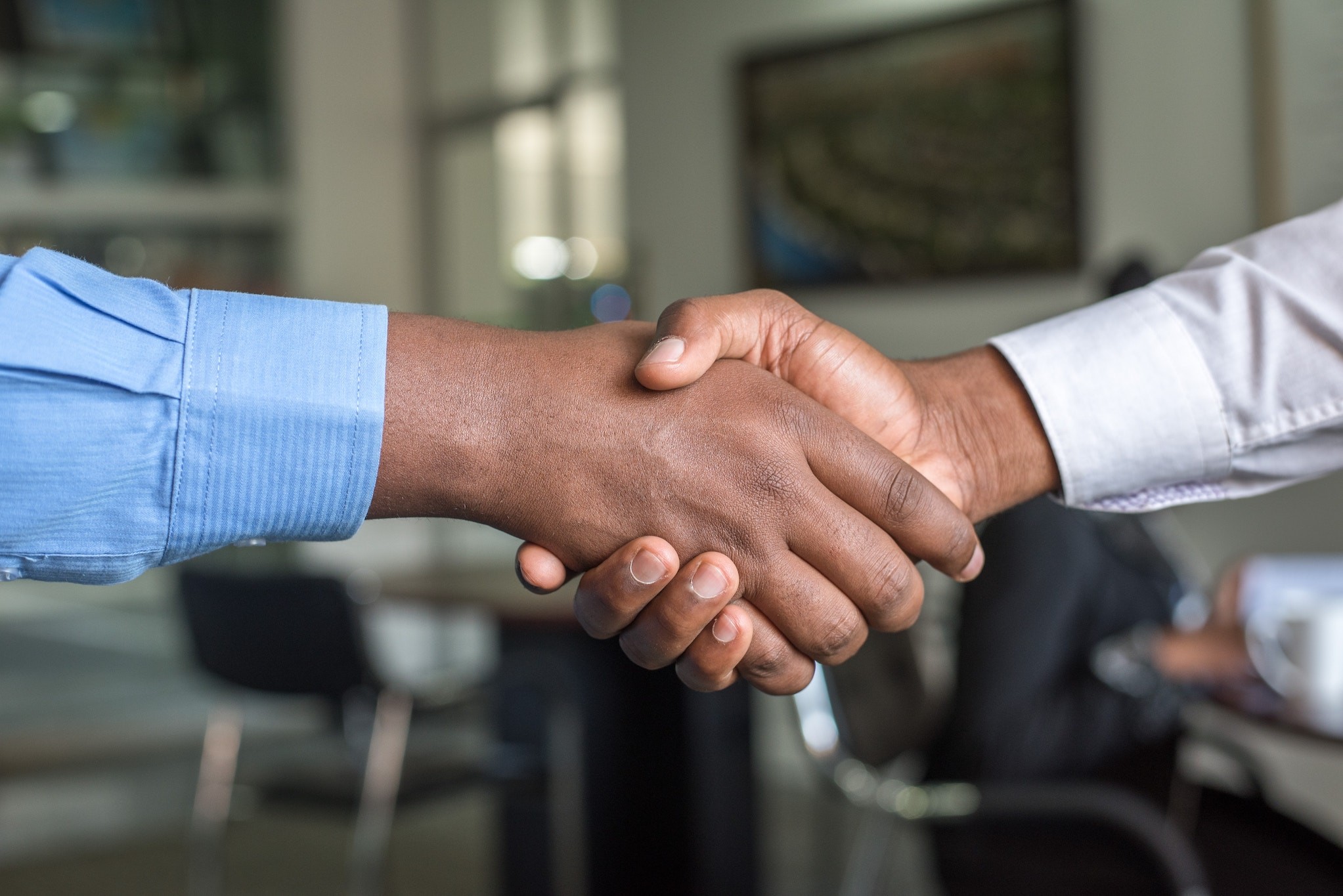 Co host shaking hand with host