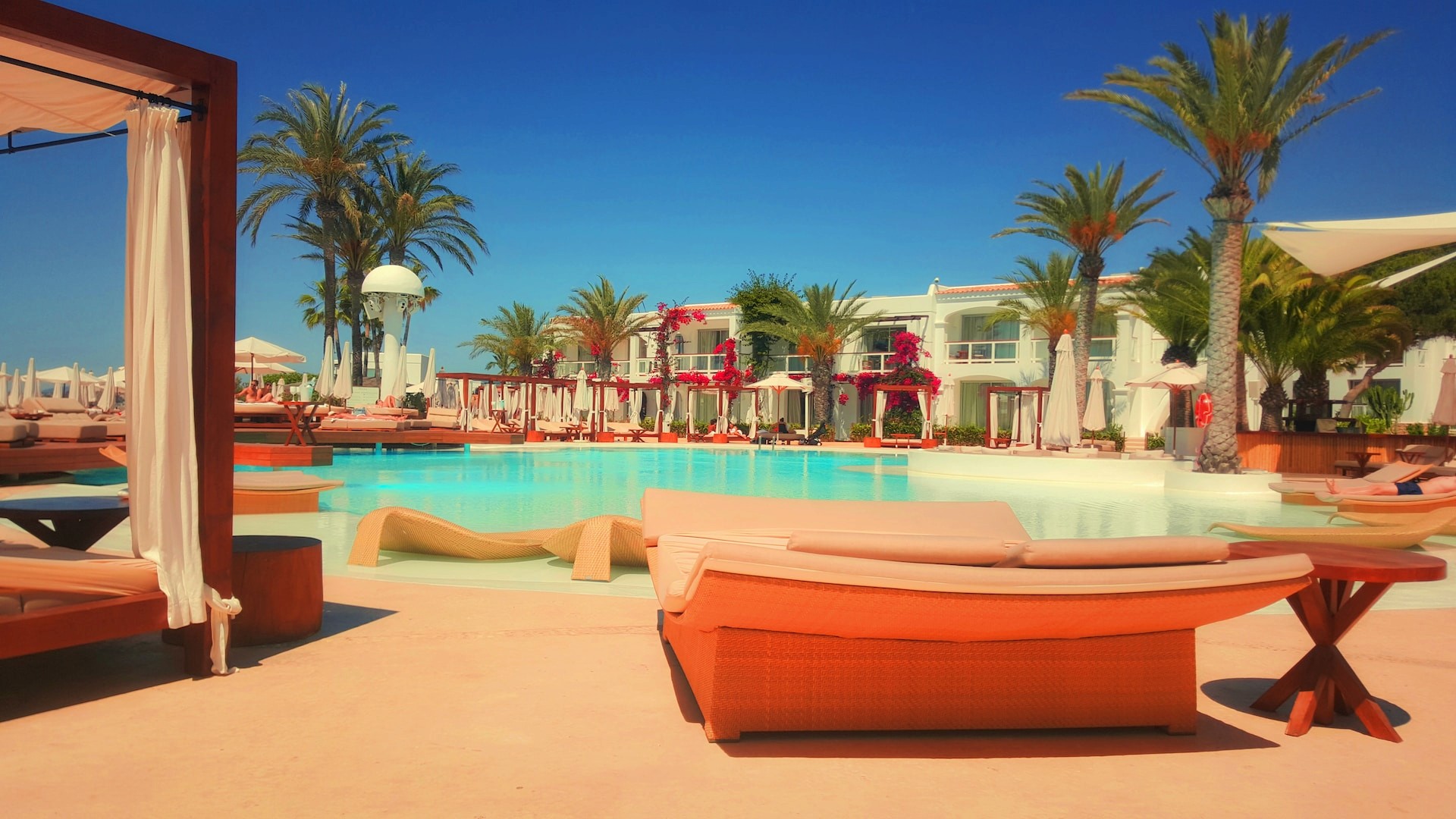 A Pool with Lounge Chairs and Umbrellas Enhancing the Guest Experience in Short-Term Rentals